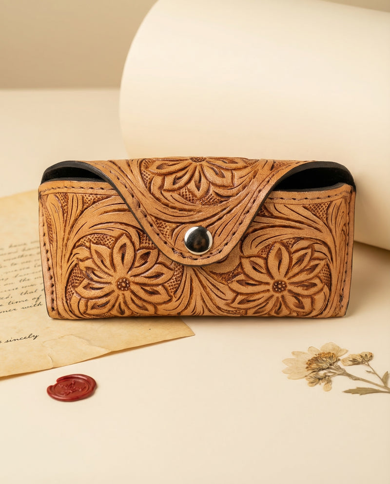 Camel tan hand-tooled leather sunglasses case with dense floral carving by Ya Qalbi