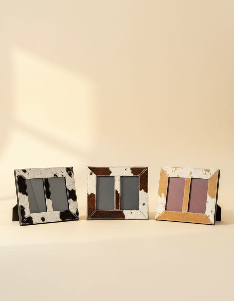Double hair-on leather photo frames in black and white, brown and white, and tan