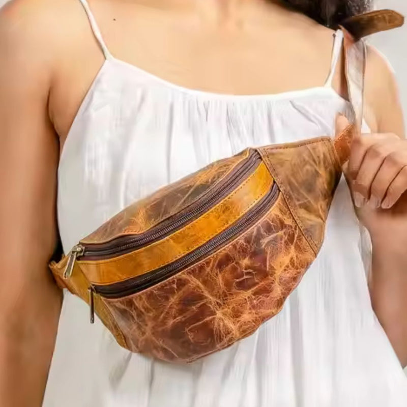 Person wearing a brown leather fanny pack multi zips