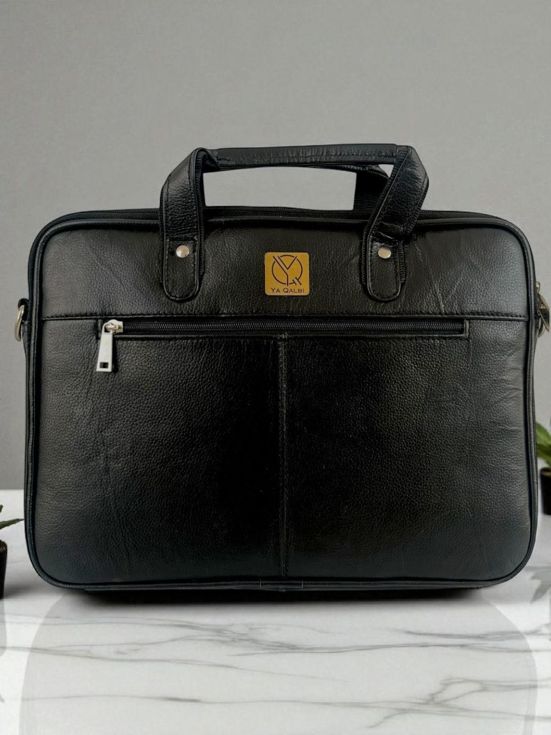 Black leather laptop bag with front zip pocket