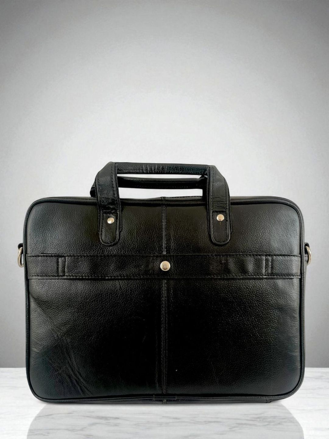Black leather laptop bag, straight-on view
