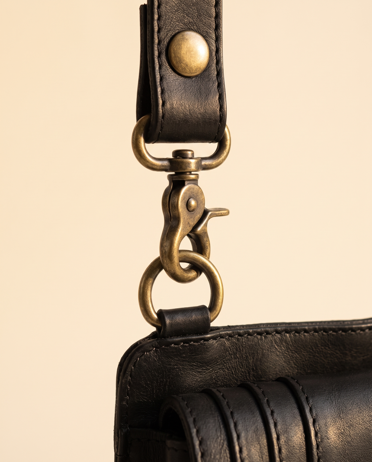 Black leather harness bag with two detachable pouches, by Ya Qalbi