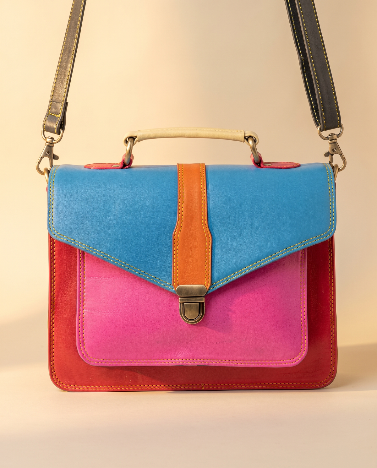 Blue and pink colour-block leather satchel, front view