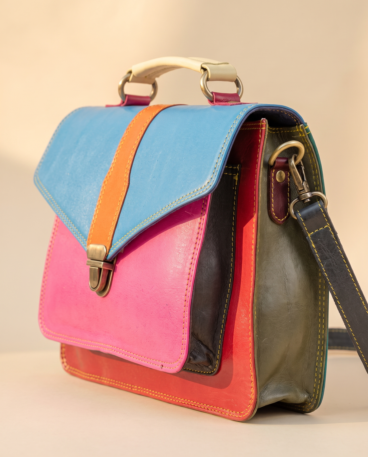 Blue and pink colour-block satchel, angled view