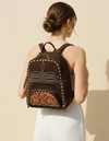 Dark brown suede backpack with white boot stitch embroidery, buckstitch lacing and tooled leather floral front pocket