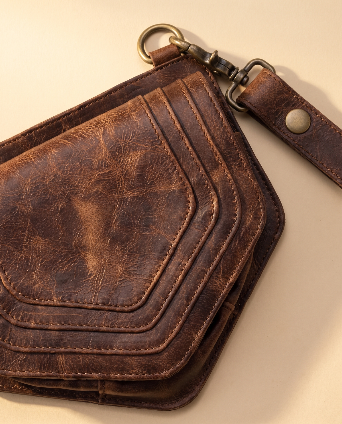 Dark brown and yellow hand-painted antler leather harness bag with gemstone, by Ya Qalbi