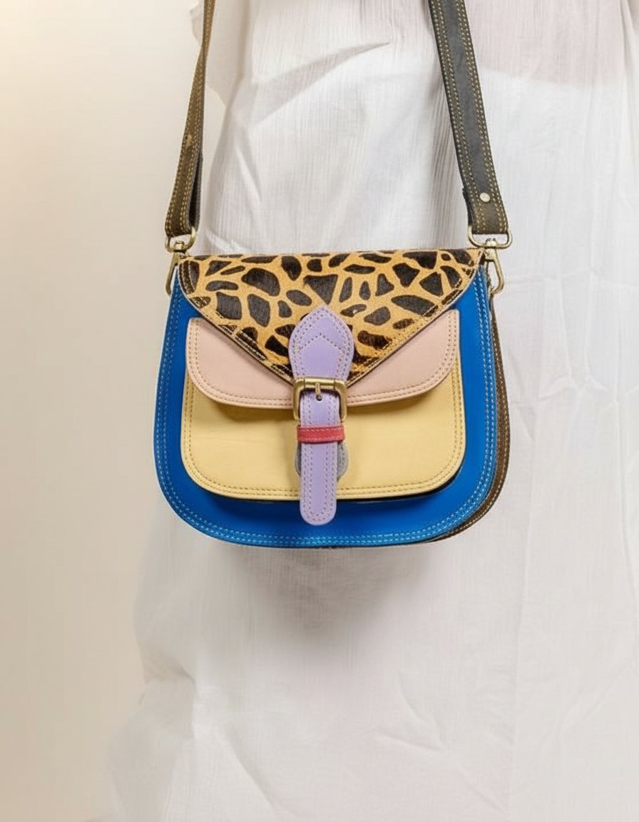 One-of-one hair-on flap saddle bag, giraffe flap saddle lilac buckle colourway (cowhide)