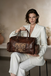 Cross-country leather weekender duffle by Ya Qalbi