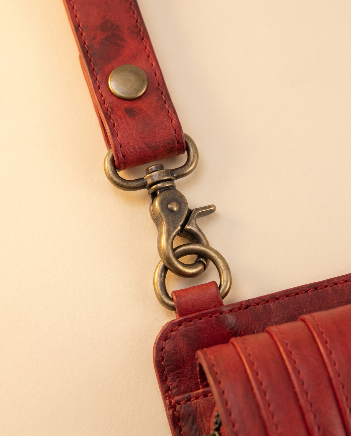 Red leather harness bag with two detachable pouches, by Ya Qalbi