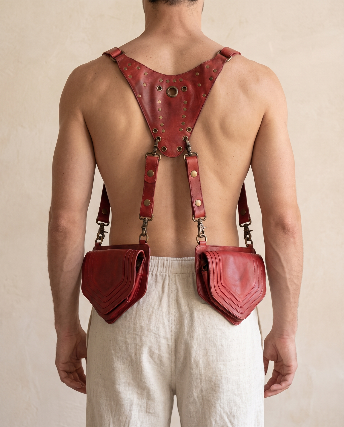 Red leather harness bag with two detachable pouches, by Ya Qalbi