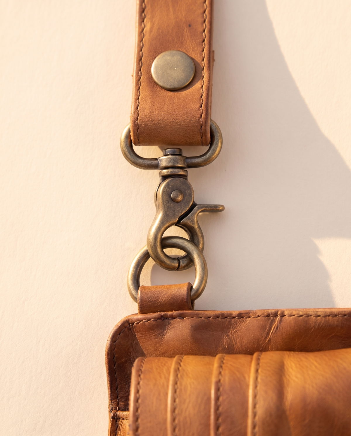 Tan and black hand-painted antler leather harness bag with gemstone, by Ya Qalbi