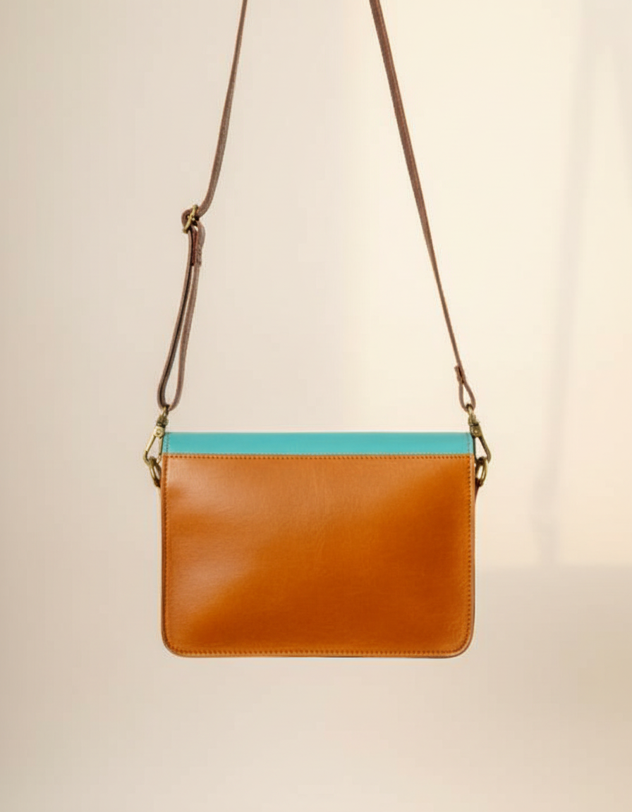 One-of-one turquoise and yellow leather envelope crossbody by Ya Qalbi