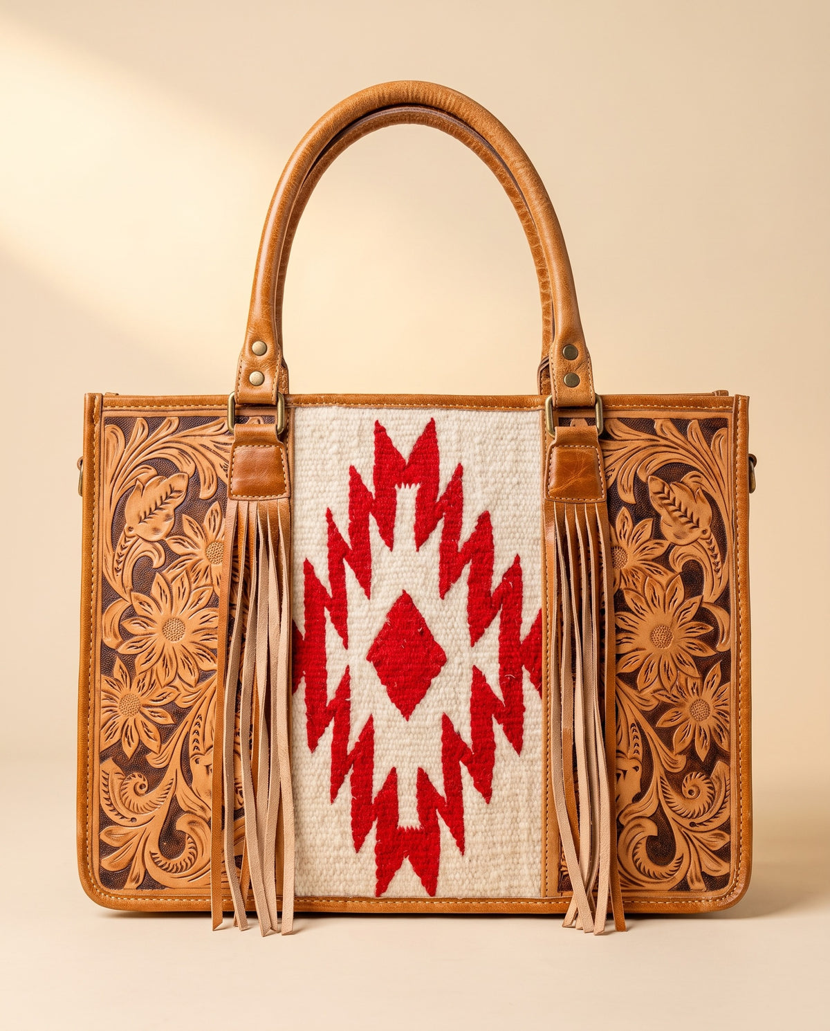 Red Aztec weave hand-tooled leather tote with fringe, front view, by Ya Qalbi
