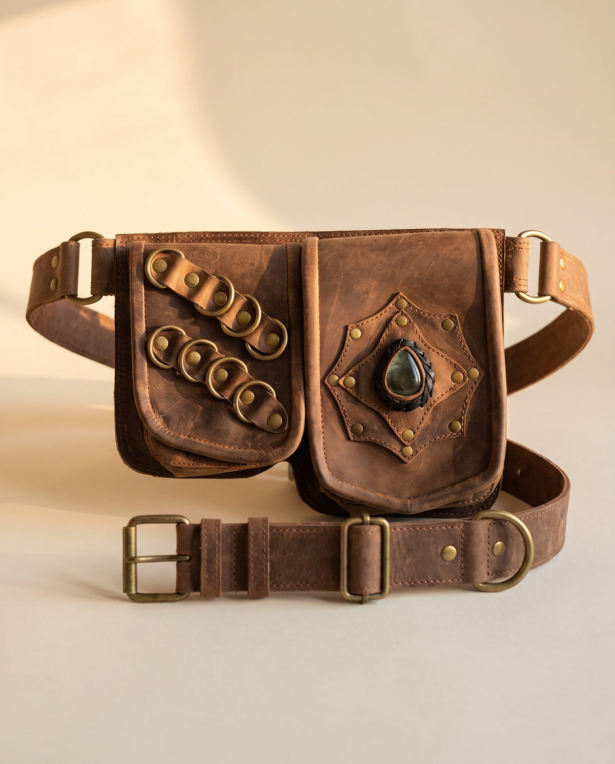 Brown double pouch leather hip belt with rings and stone, front view, by Ya Qalbi