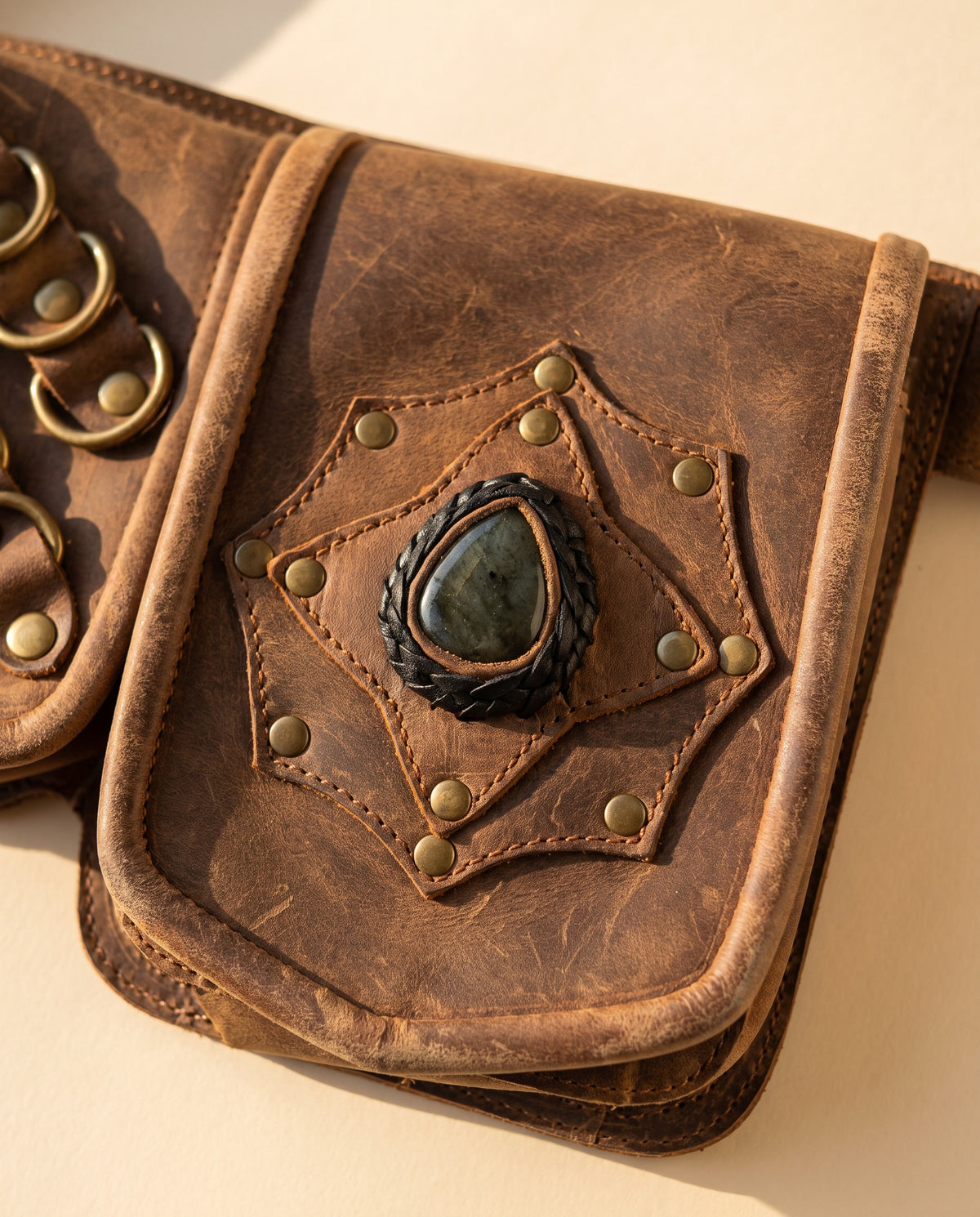 Brown double pouch leather hip belt with rings and stone, detail close-up, by Ya Qalbi
