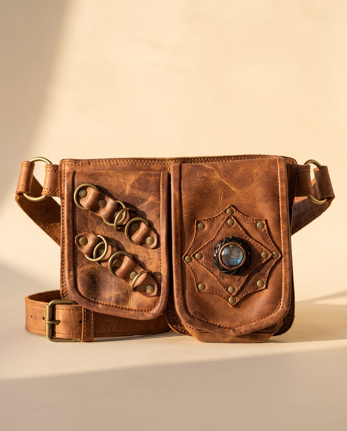 Tan double pouch leather hip belt with rings and stone, front view, by Ya Qalbi