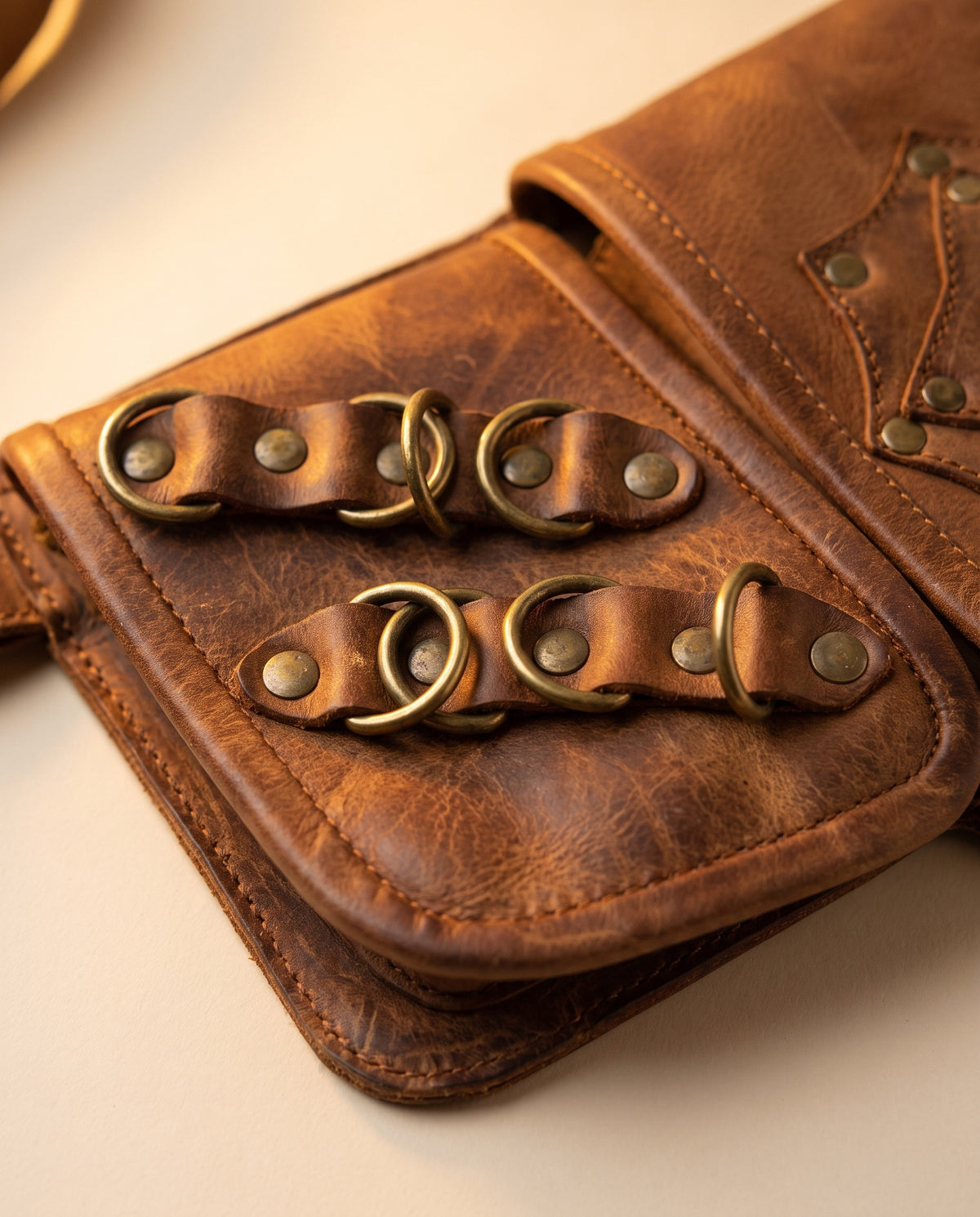 Tan double pouch leather hip belt with rings and stone, detail close-up, by Ya Qalbi