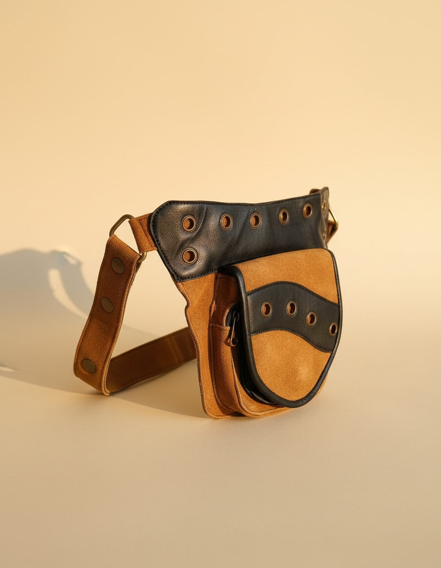 Tan and black eyelet suede hip bag, angled view, by Ya Qalbi