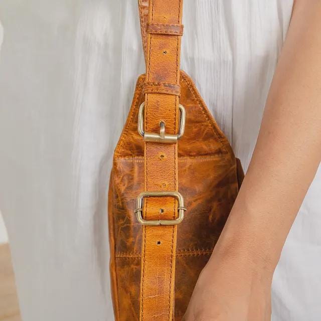 Genuine leather waist pouch with brass hardware by Ya Qalbi