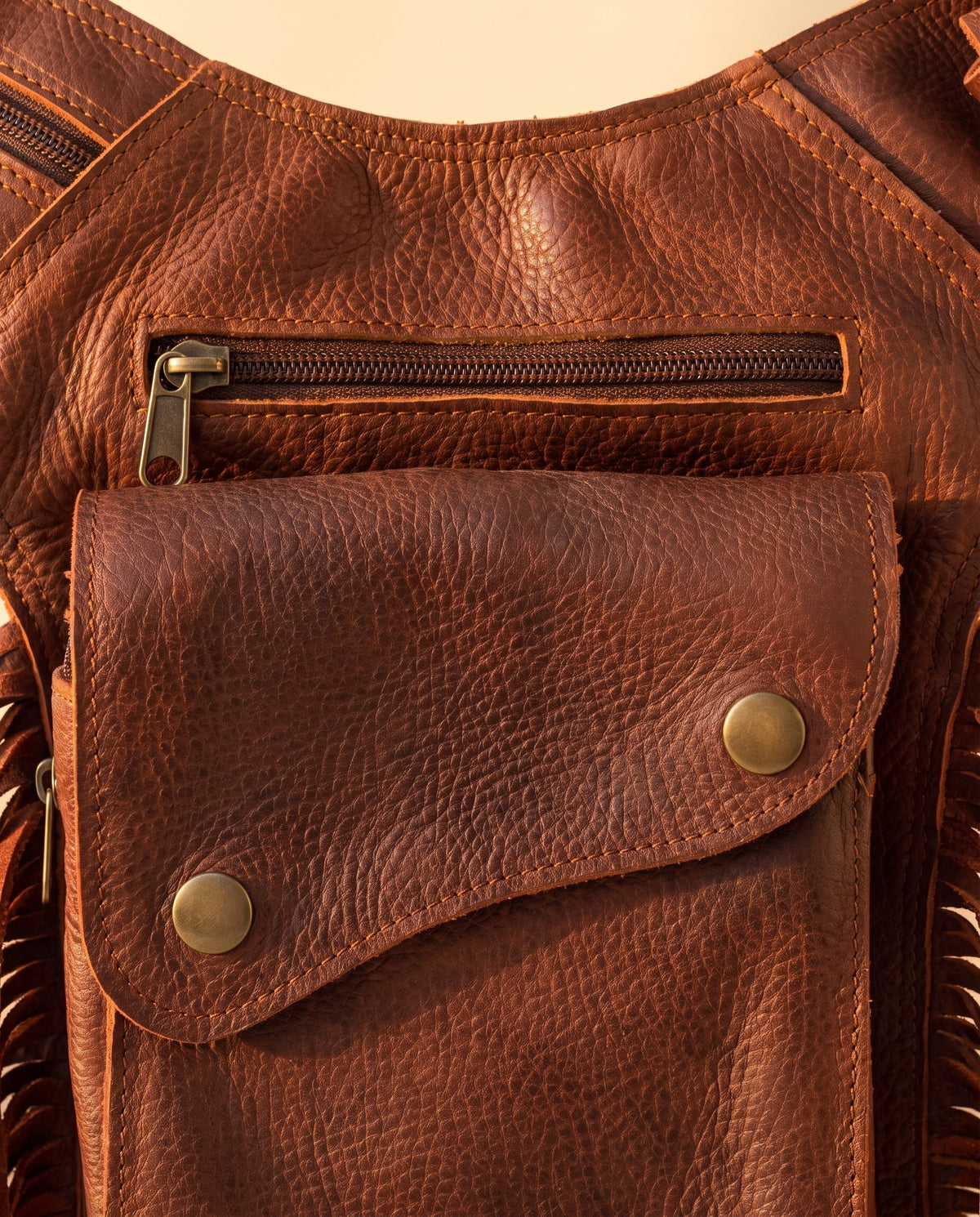 Brown fringe leather holster hip bag, detail close-up, by Ya Qalbi
