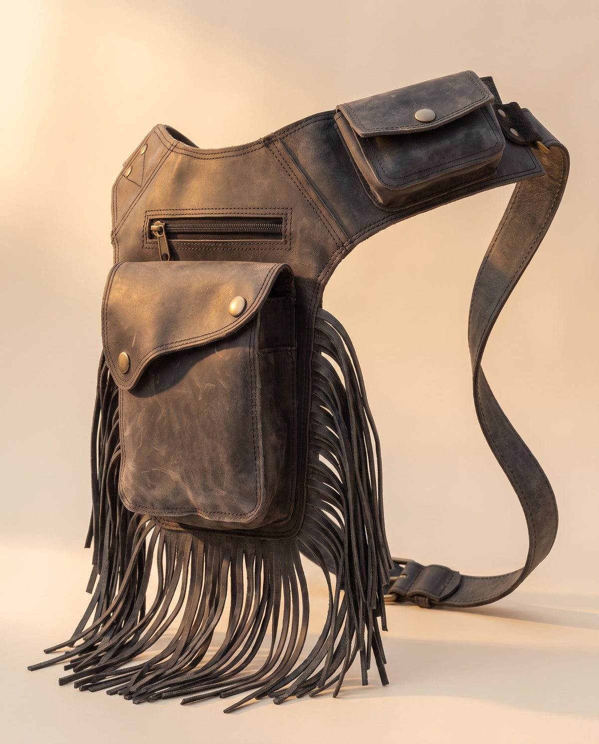 Charcoal fringe leather holster hip bag, angled view, by Ya Qalbi