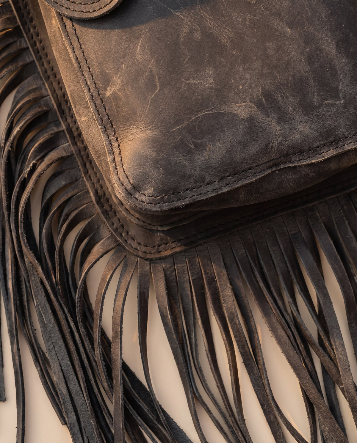 Charcoal fringe leather holster hip bag, detail close-up, by Ya Qalbi