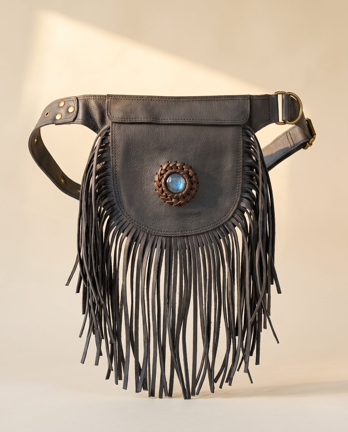Black fringe leather hip bag with stone, front view, by Ya Qalbi