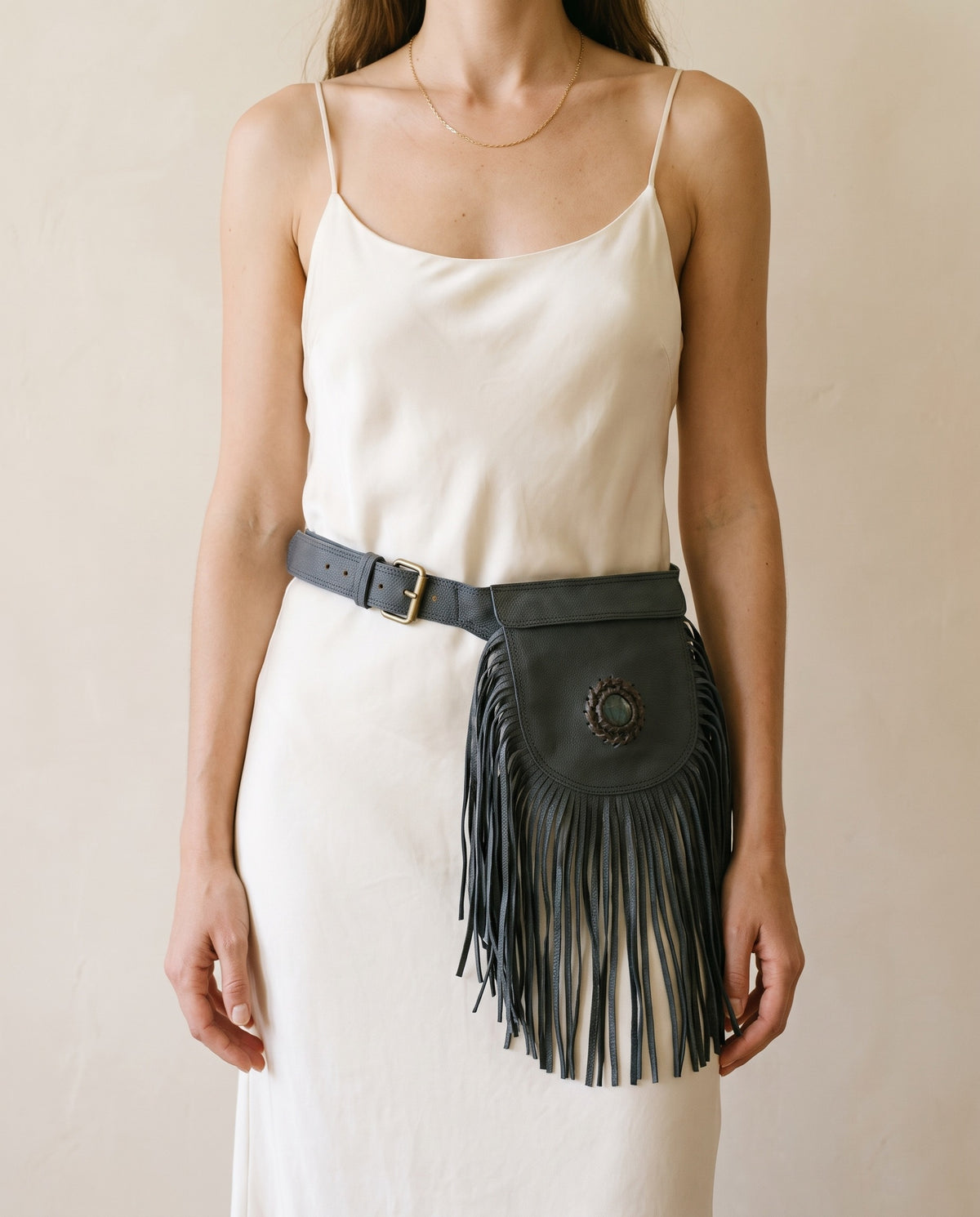 Black fringe leather hip bag with stone, detail close-up, by Ya Qalbi