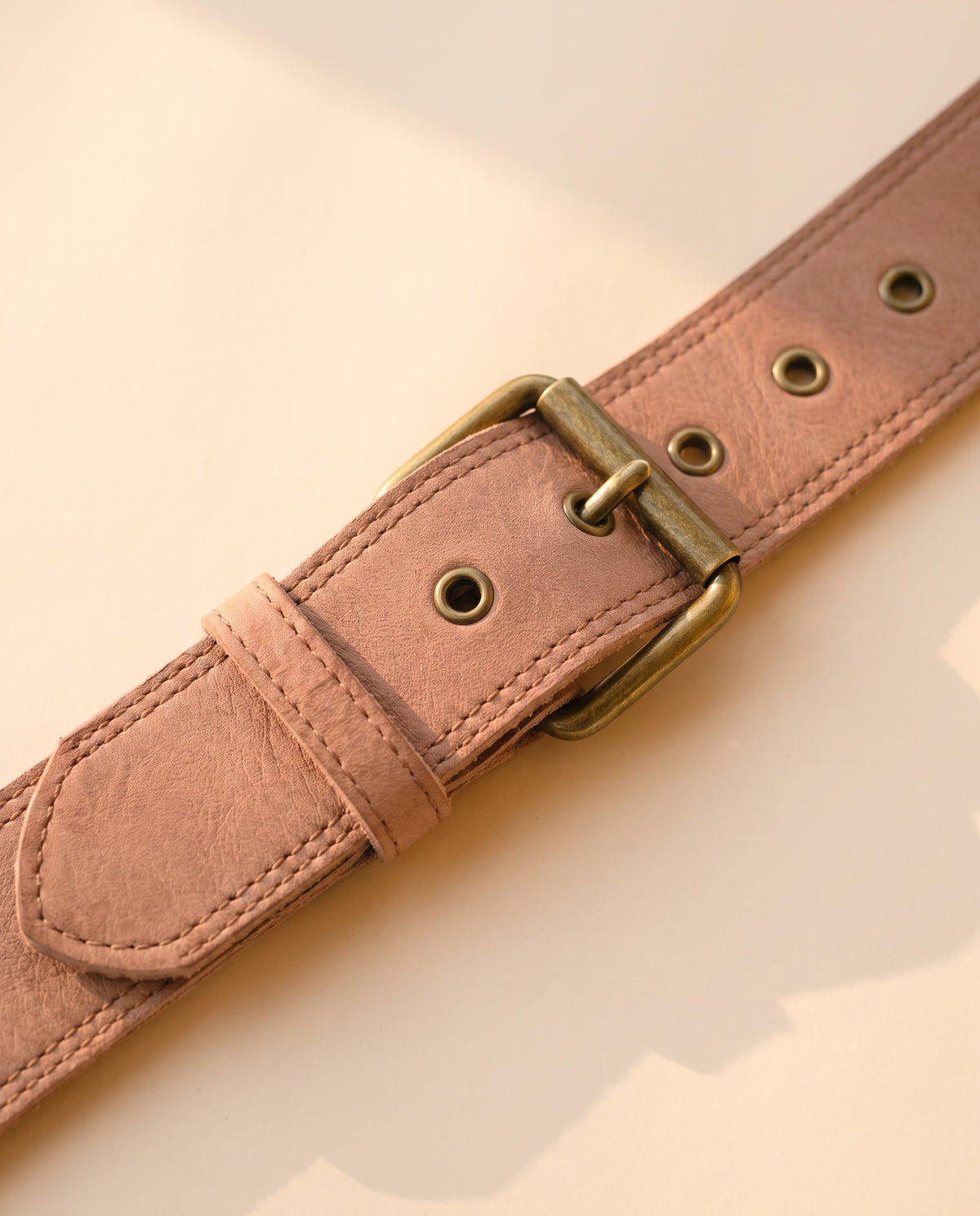 Blush fringe leather hip bag with stone, detail close-up, by Ya Qalbi