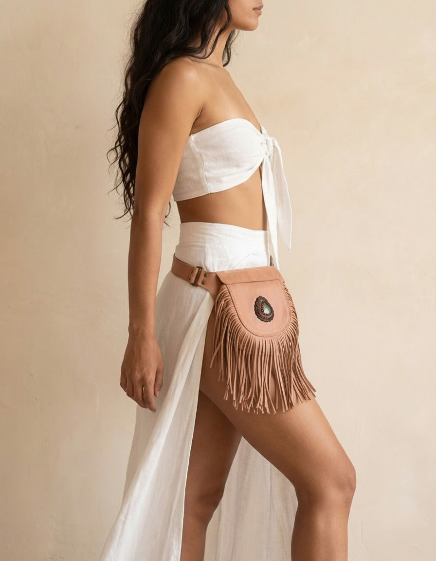 Blush fringe leather hip bag with stone, worn by a model, by Ya Qalbi