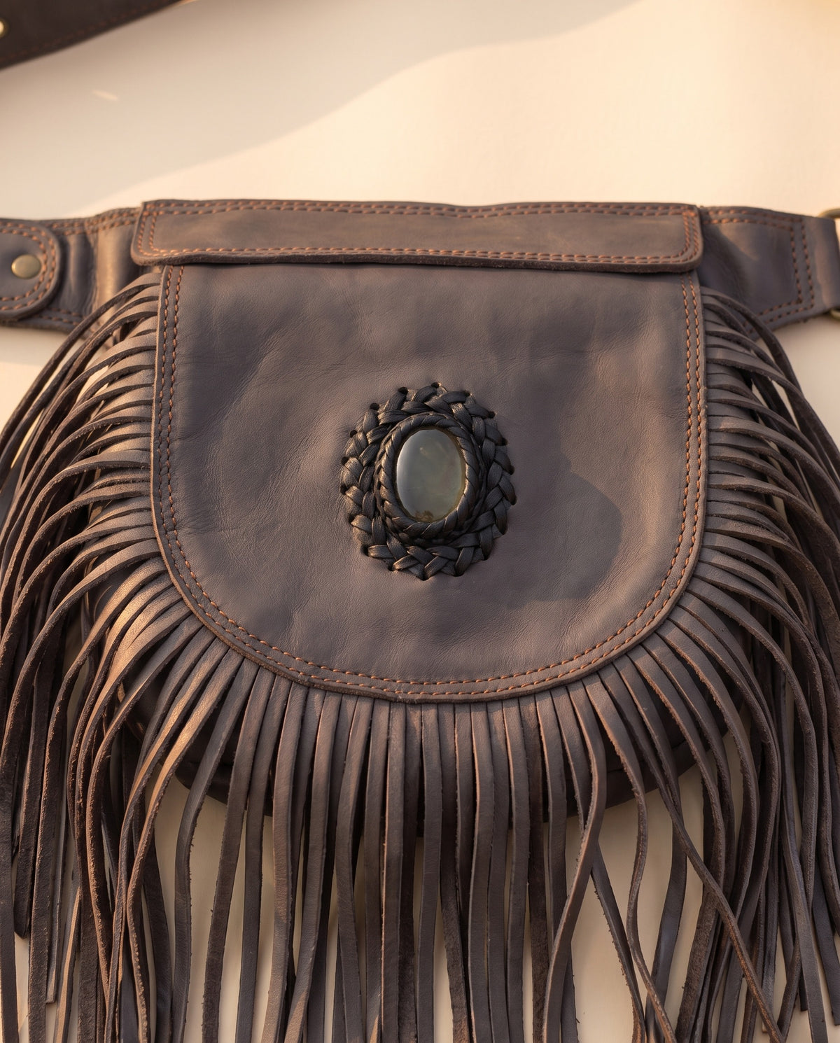 Grey fringe leather hip bag with stone, detail close-up, by Ya Qalbi