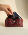Red hand-carved leather glasses pouch artisan detail by Ya Qalbi