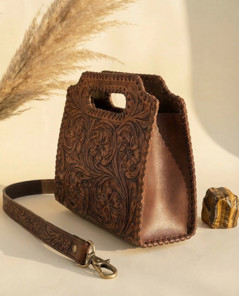 Full-grain brown leather top-handle clutch tote with whipstitch by Ya Qalbi