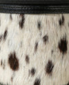 Statement hair-on leather makeup pouch by Ya Qalbi