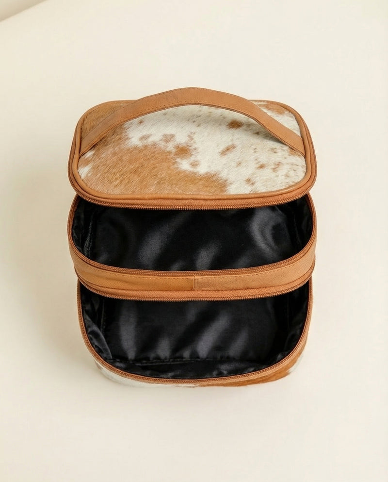 Western leather vanity bag with natural cowhide pattern by Ya Qalbi