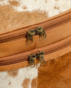 Statement hair-on cowhide makeup pouch by Ya Qalbi