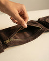 Brown handcrafted leather belt with multiple pockets by Ya Qalbi