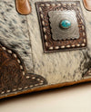 Cowhide leather weekender with hand-tooled border by Ya Qalbi