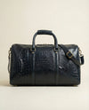 Full-grain blue croc leather travel duffle by Ya Qalbi