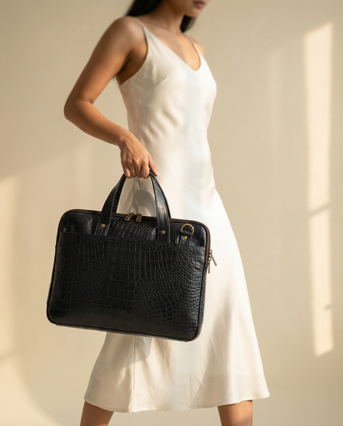Woman carrying navy blue croc leather laptop briefcase