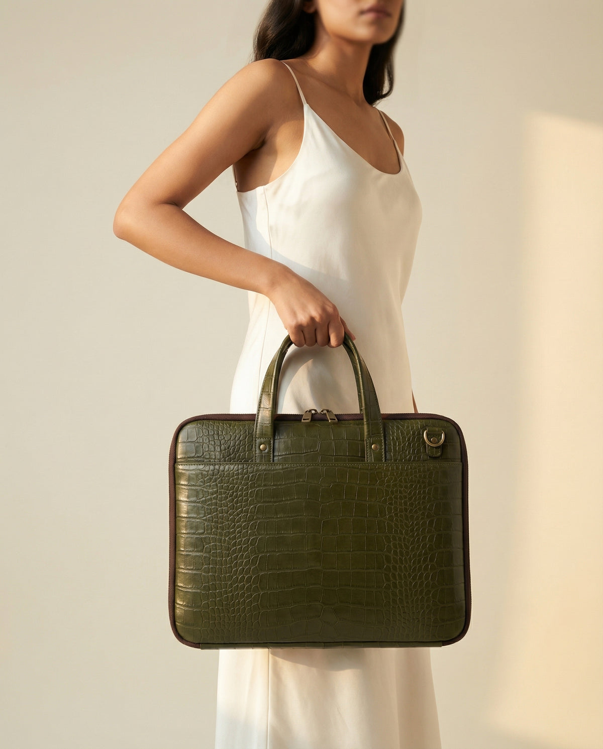 Woman carrying olive green croc leather laptop briefcase