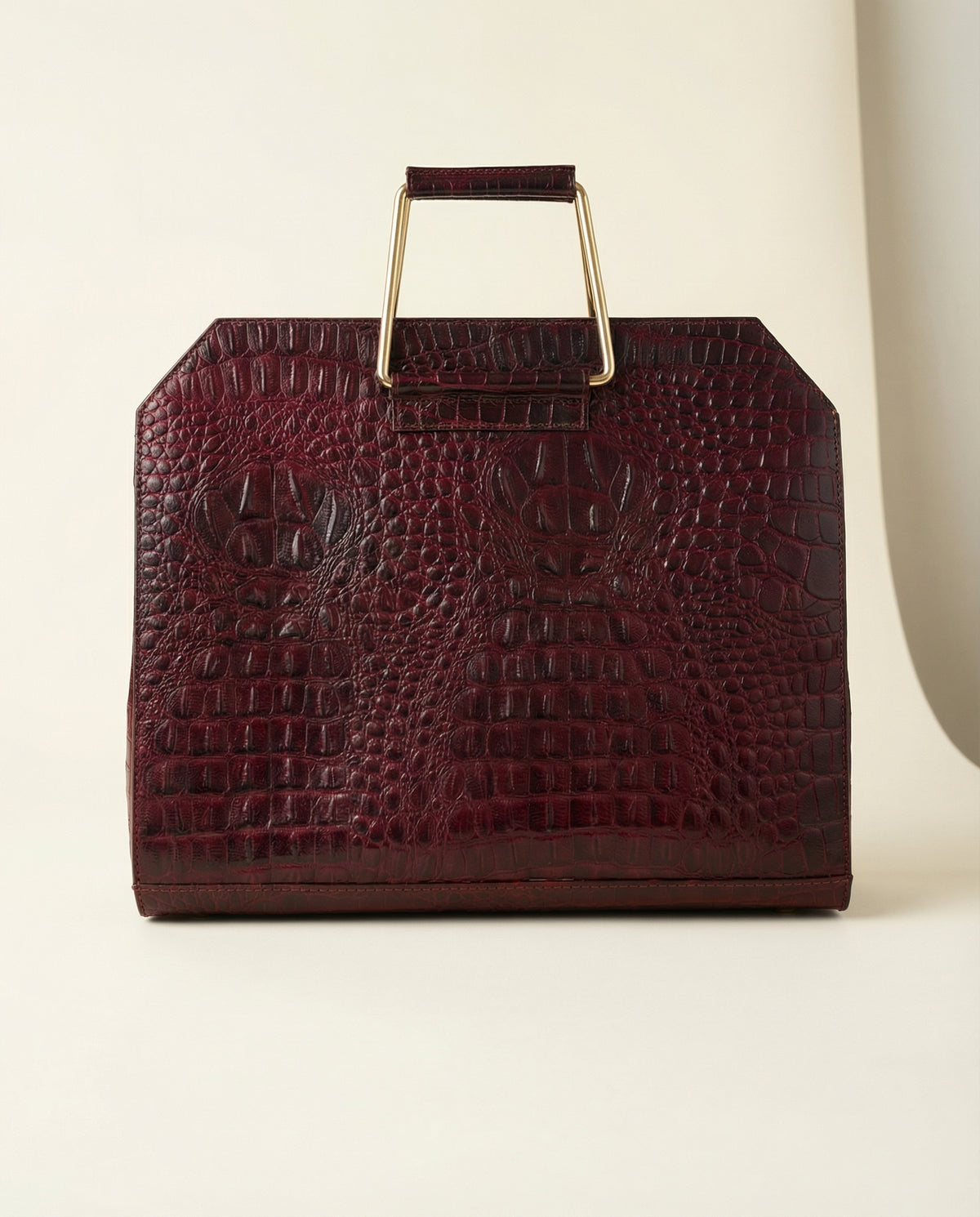 Wine croc leather laptop bag with steel frame handle, front view
