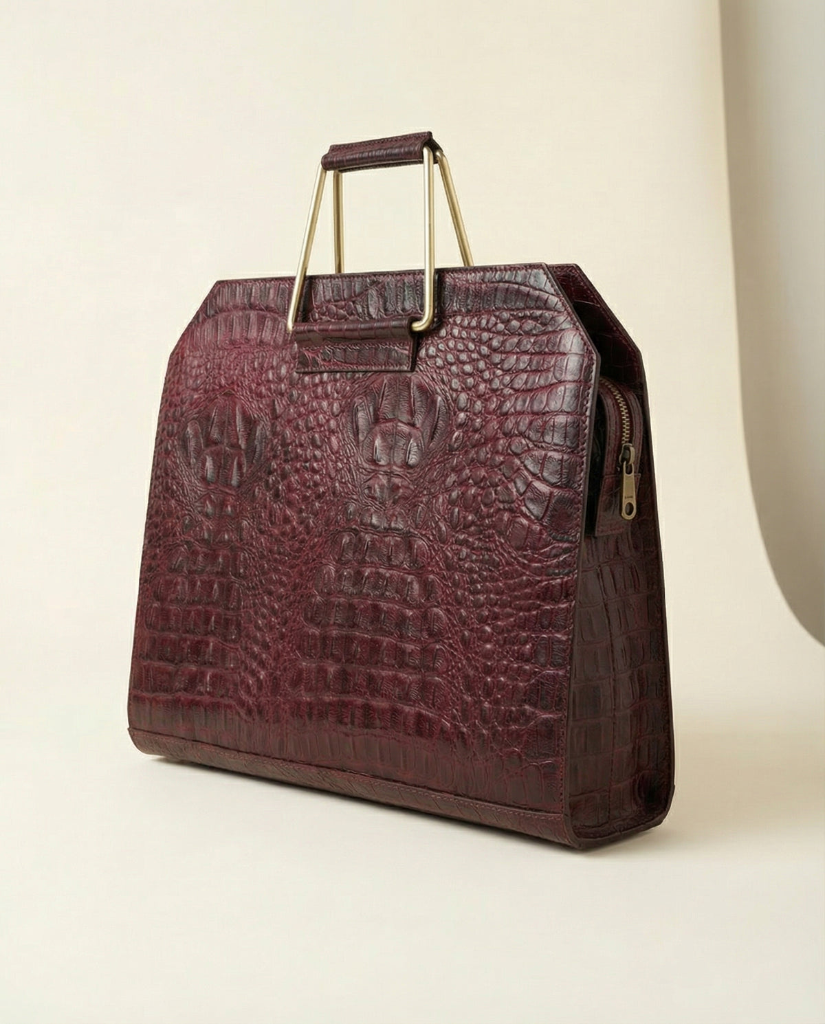 Wine croc leather laptop bag, angled view