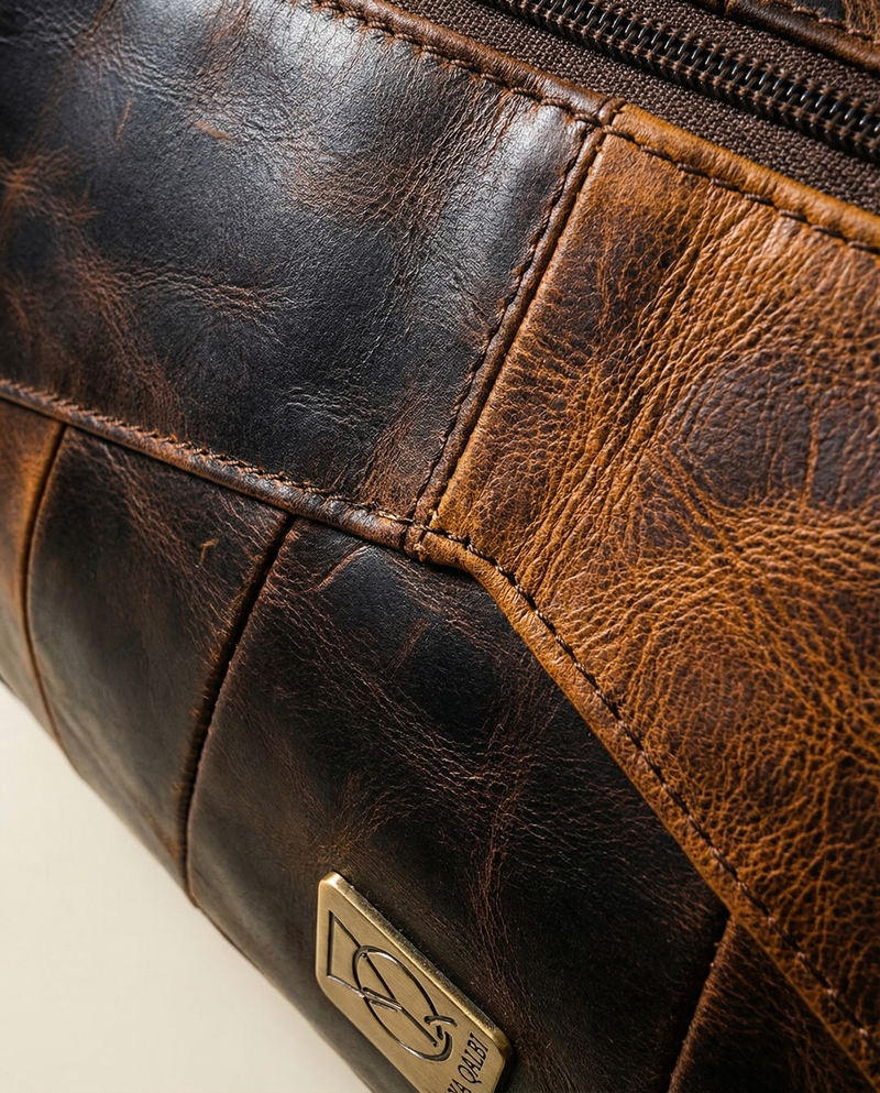 Hard wax leather travel duffle side angle by Ya Qalbi