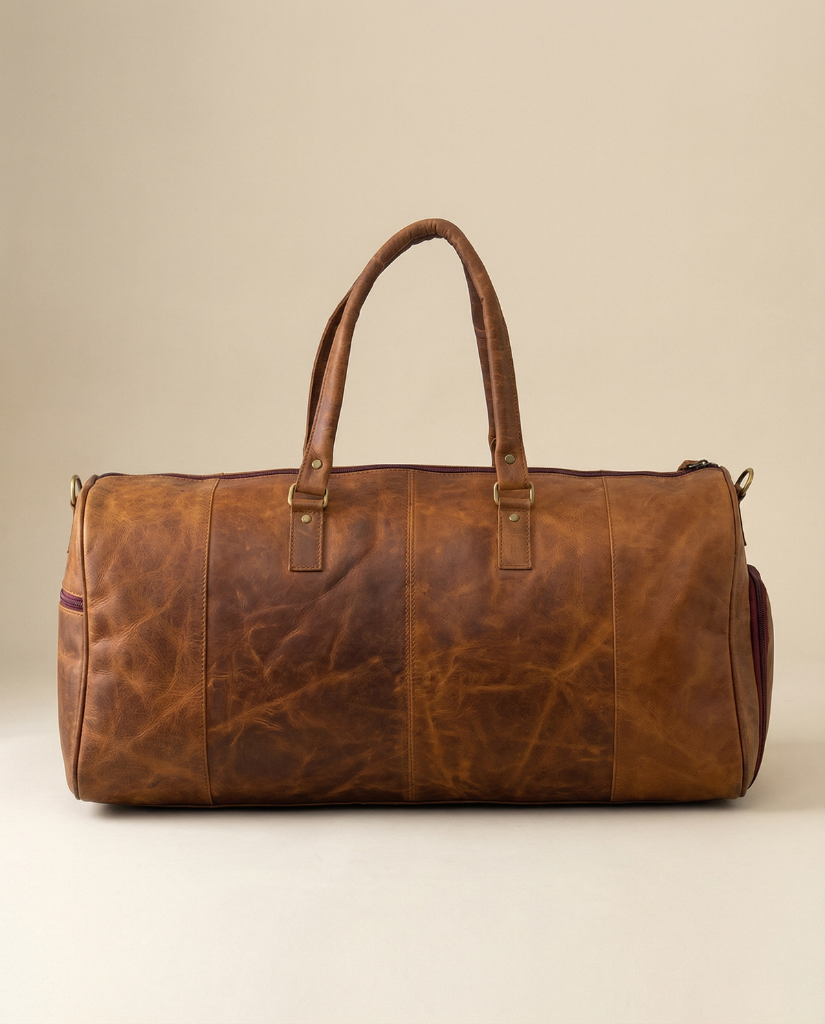 Leather overnight bag with hand-stitched detail by Ya Qalbi