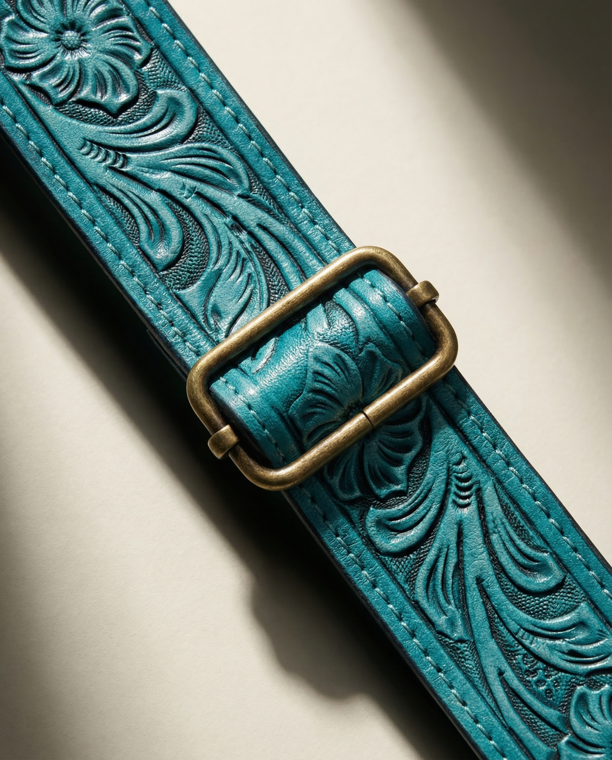 Hand-tooled turquoise leather strap with brass buckle by Ya Qalbi