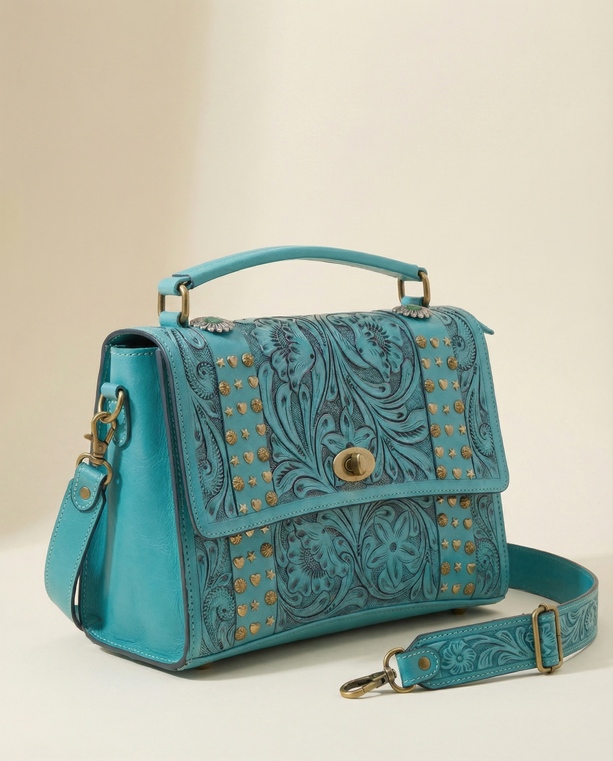 Turquoise tooled leather satchel with detachable crossbody strap by Ya Qalbi