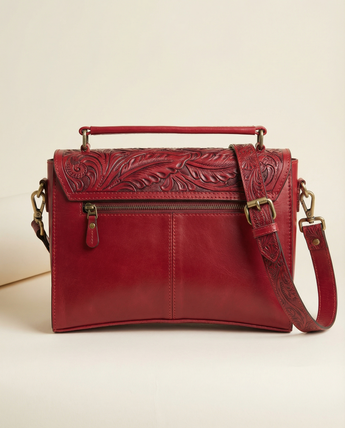 Back view of red tooled leather satchel with zip pocket by Ya Qalbi