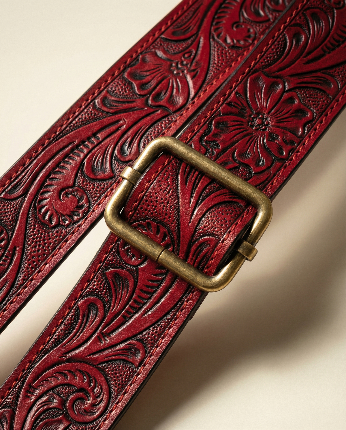 Hand-tooled red leather strap with brass buckle by Ya Qalbi