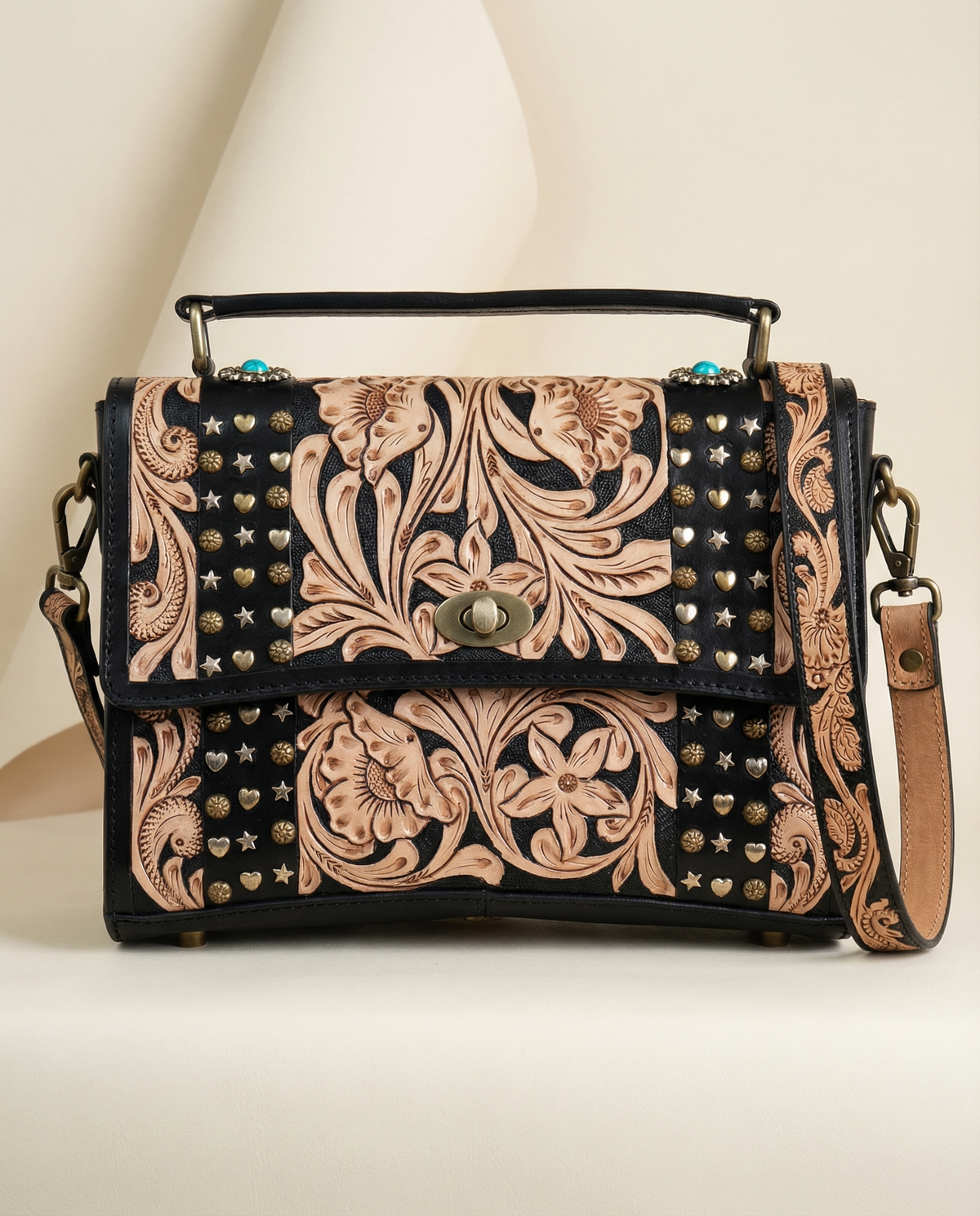 Midnight black tooled leather crossbody satchel with natural carving and brass studs by Ya Qalbi